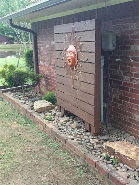 how to cover up electrical box in yard|hiding utility boxes around house.